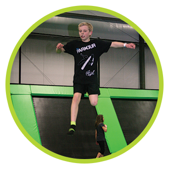 Young man bouncing high on the trampolines