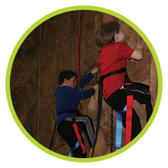 Kids climbing on rock wall